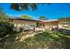 Charming home exterior featuring a well-maintained lawn and landscape at 2640 Westchester N Dr, Clearwater, FL 33761