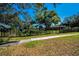 House exterior, partially obscured by trees at 2640 Westchester N Dr, Clearwater, FL 33761