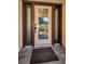 Elegant front door featuring decorative glass panels and dark trim at 2640 Westchester N Dr, Clearwater, FL 33761