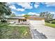 Charming single-story home with attached garage, well-maintained lawn, and beautiful curb appeal at 2640 Westchester N Dr, Clearwater, FL 33761