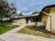 Charming single-story home featuring well-maintained landscaping and inviting walkway at 2640 Westchester N Dr, Clearwater, FL 33761