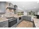 This kitchen offers granite counters, stainless steel appliances and a seamless access to the living area at 2640 Westchester N Dr, Clearwater, FL 33761