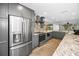 Updated kitchen offers granite counters, stainless appliances, and seamless access to the living area at 2640 Westchester N Dr, Clearwater, FL 33761