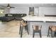 Spacious kitchen bar with granite counters and bar seating, perfect for entertaining and casual dining at 2640 Westchester N Dr, Clearwater, FL 33761