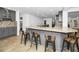 The spacious kitchen features an island with bar seating, granite counters, and stainless appliances at 2640 Westchester N Dr, Clearwater, FL 33761