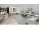 Bright living room features tile floors, neutral paint, and an open floorplan perfect for entertaining at 2640 Westchester N Dr, Clearwater, FL 33761