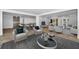 Bright living room featuring neutral furniture, stylish decor, and an open floor plan at 2640 Westchester N Dr, Clearwater, FL 33761