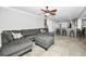 Cozy living room showcasing sectional sofa with an open transition into the kitchen at 2640 Westchester N Dr, Clearwater, FL 33761