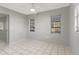 Bedroom with tile floors and two windows at 2723 24Th St, Sarasota, FL 34234