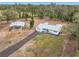 Aerial view of home and carport on a large lot at 302 E Keysville Rd, Plant City, FL 33567