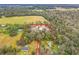 Aerial view of property showcasing home, large lot, and surrounding land at 302 E Keysville Rd, Plant City, FL 33567