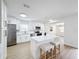 Modern white kitchen with stainless steel appliances and an island at 302 E Keysville Rd, Plant City, FL 33567