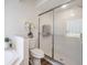 Clean bathroom with a glass-enclosed shower and modern fixtures at 35608 Welby Ct, Zephyrhills, FL 33541