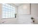 Bathtub with a glass block window and modern bathroom decor at 35608 Welby Ct, Zephyrhills, FL 33541