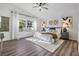 Spacious bedroom with large window, hardwood floors and neutral decor at 35608 Welby Ct, Zephyrhills, FL 33541