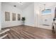 Spacious entryway with high ceilings, wood flooring, and stylish decorative accents at 35608 Welby Ct, Zephyrhills, FL 33541