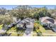 Charming single-story home featuring a well-manicured lawn, mature trees, and a two-car garage at 35608 Welby Ct, Zephyrhills, FL 33541