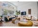 Spacious living area featuring a comfortable sectional sofa and large windows at 35608 Welby Ct, Zephyrhills, FL 33541