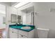 Clean bathroom with teal countertop, single sink and toilet at 3722 Village Estates Pl, Tampa, FL 33618