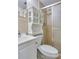 Bathroom with shower, toilet, and white vanity at 4020 55Th N St # 1103, Kenneth City, FL 33709