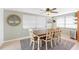 Charming dining area with wood table and four chairs at 4852 Fleetwood St, New Port Richey, FL 34653