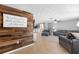 Bright and airy living room with a rustic accent wall at 4852 Fleetwood St, New Port Richey, FL 34653