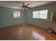 Spacious bedroom with wood flooring and a ceiling fan at 6035 Grand Blvd, New Port Richey, FL 34652