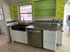 Updated kitchen with stainless steel appliances and a farmhouse sink at 6035 Grand Blvd, New Port Richey, FL 34652