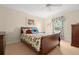 Charming bedroom with a floral bedspread and plenty of light at 615 Westfield Ct, Dunedin, FL 34698