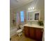 Clean bathroom with a vanity, bathtub, and updated fixtures at 703 Old Charleston Way, Largo, FL 33770
