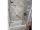 Updated bathroom with a walk-in shower and modern tile at 703 Old Charleston Way, Largo, FL 33770