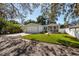 House exterior view, driveway, and street at 703 Old Charleston Way, Largo, FL 33770