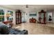 Open concept living area with multiple display cabinets at 703 Old Charleston Way, Largo, FL 33770