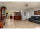 Open living area with kitchen views and tile flooring at 703 Old Charleston Way, Largo, FL 33770