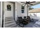 Relaxing screened porch with rocking chairs at 703 Old Charleston Way, Largo, FL 33770