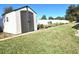 Small storage shed in backyard next to fence at 735 Challice Dr, Spring Hill, FL 34609