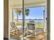 Access to balcony with relaxing patio furniture at 7862 Sailboat Key S Blvd # 106, South Pasadena, FL 33707