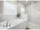 Bathroom with a large soaking tub and a separate shower at 8024 Abby Brooks Cir, Wesley Chapel, FL 33545