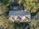 Property's aerial view showing the house, pool, and surrounding landscape at 11201 Kerry Hills Ct, Riverview, FL 33569