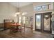 Elegant dining room with hardwood floors, antique furniture and large windows at 11201 Kerry Hills Ct, Riverview, FL 33569