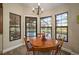 Kitchen nook with round table and view of the pool at 11201 Kerry Hills Ct, Riverview, FL 33569