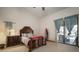 Main bedroom with a king-size bed and access to the pool area at 11201 Kerry Hills Ct, Riverview, FL 33569