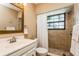 Clean bathroom with shower and white vanity at 10494 Saint Tropez Pl # 202, Tampa, FL 33615