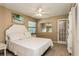 Cozy bedroom with double bed and French doors at 10494 Saint Tropez Pl # 202, Tampa, FL 33615