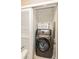 Well-lit laundry room with washer and dryer at 10494 Saint Tropez Pl # 202, Tampa, FL 33615