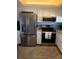 Modern kitchen with stainless steel appliances at 106 1St E St # 105, St Petersburg, FL 33715