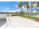 A patio area with a pool and canal provides a beautiful outdoor living space at 11300 8Th E St, Treasure Island, FL 33706