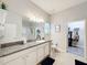 Elegant bathroom with granite countertops, walk-in shower, and large closet at 11409 Drifting Leaf Dr, Riverview, FL 33579