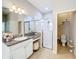Elegant bathroom with granite vanity, shower, and separate toilet area at 11409 Drifting Leaf Dr, Riverview, FL 33579