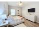 Charming bedroom with a double bed, dresser, and ceiling fan at 11409 Drifting Leaf Dr, Riverview, FL 33579